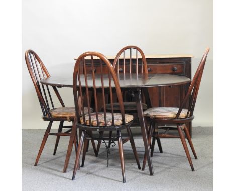 An Ercol dark elm drop leaf table, 125 x 112cm, together with four Ercol dining chairs, and a sideboard (6)