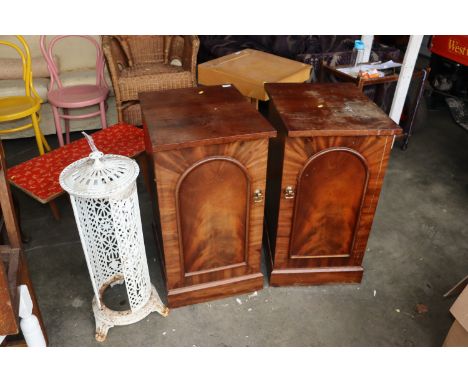 A pair of Victorian mahogany pedestal cupboards and a vintage stove casing, incomplete