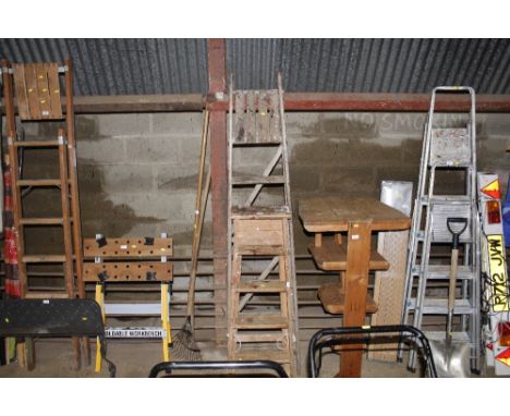Two wooden folding step ladders