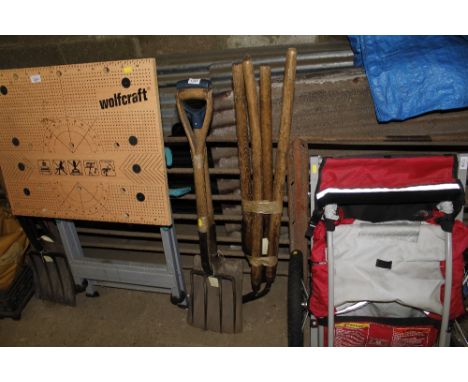 A garden fork, shovel, pair of loppers and edging shears
