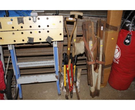 A garden fork, shovel, loppers and shears