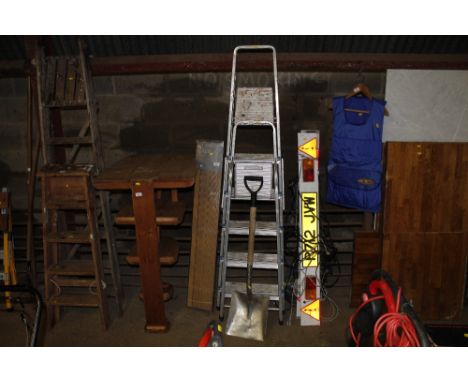 Two aluminium folding step ladders and a shovel 