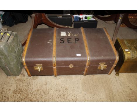 A wooden bound traveling trunk