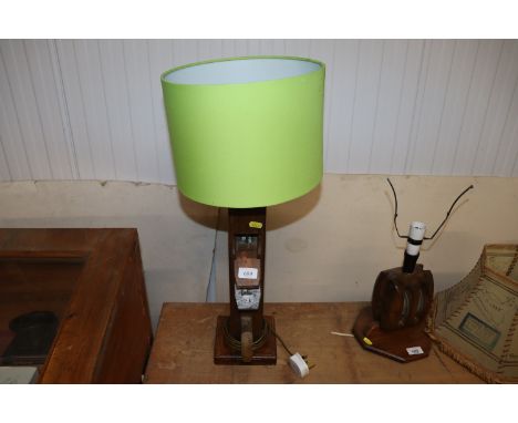 A vintage wooden table lamp, made from a plane