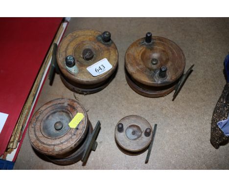 Four vintage wooden fishing reels 