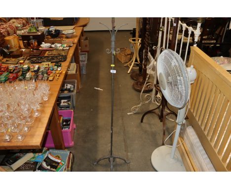 A wrought metal lamp standard