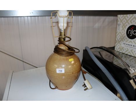 A glazed stoneware table lamp