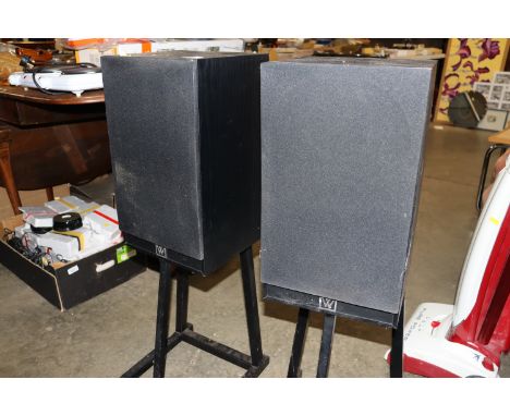 A pair of vintage speakers on stands
