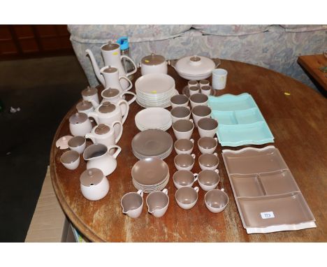 A collection of Poole pottery twin tone tea and dinnerware