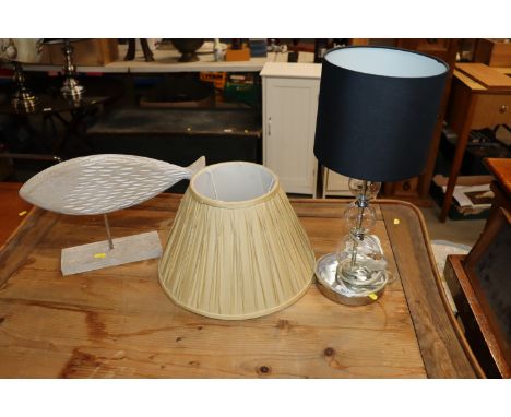 A modern design table lamp and shade, together with a wooden fish ornament etc.
