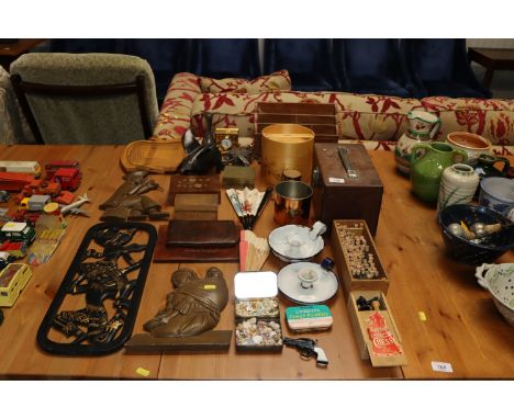 A collection of various wooden items including a stationery rack, two enamel chamber sticks, chess set, fans, various other o