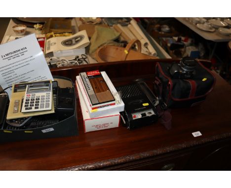 Two Mitsubishi transportable cellular telephones, various calculators, Olympus camera, vintage National cassette player etc.