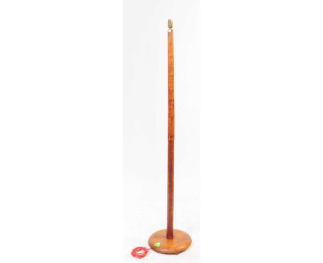 British Modern Design - A mid 20th century teak wood standard lamp. The lamp raised on a rounded wooden base, with a turned c