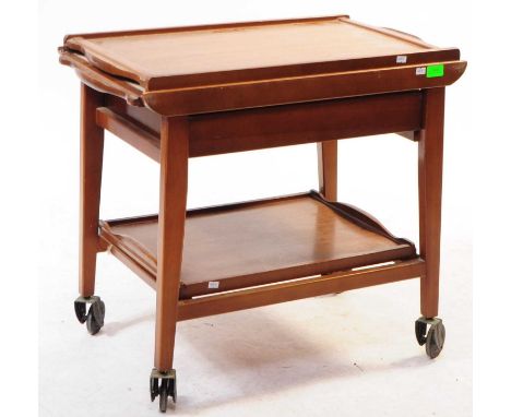 British Modern Design - A mid 20th century teak wood cocktail / drinks trolley. The trolley raised on squared supports over c