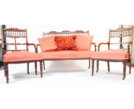 A 19th Century Victorian mahogany suite comprising of a window sofa and two armchairs. Each item having inlaid pierced design