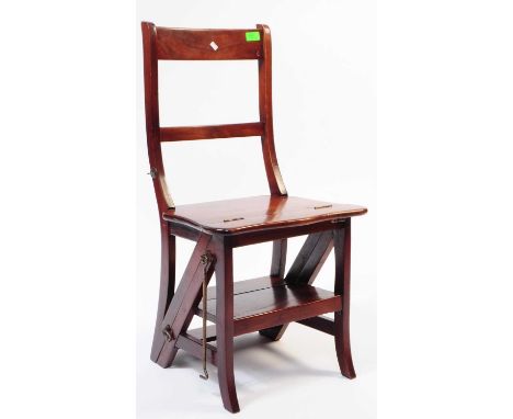 A 20th Century mahogany metamorphic folding library chair / ladder. The chair folding to form a library ladder.85x45x40cm