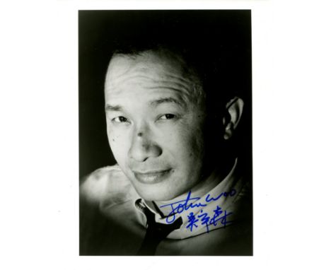 WOO JOHN: (1946-&nbsp;&nbsp;&nbsp;&nbsp; ) Hong Kong film director. Signed 8 x 10 photograph of Woo in a close-up head and sh