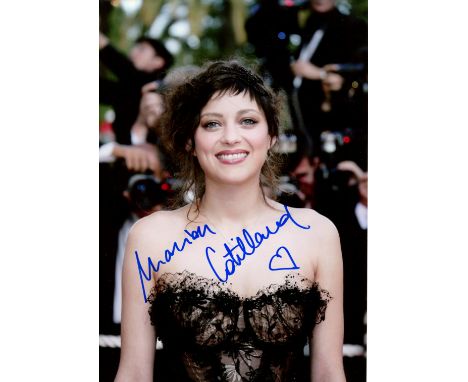COTTILARD MARION: (1975-     ) French actress, Academy Award winner. Signed colour 8 x 12 photograph of Cottilard standing ou
