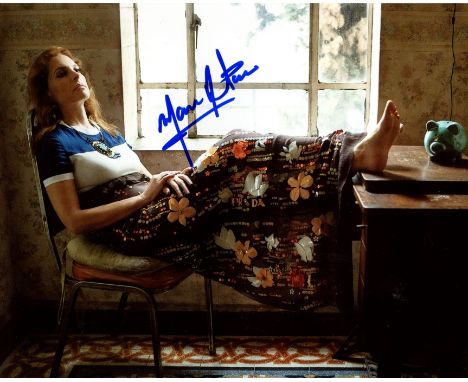 DE TAVIRA MARINA: (1974-     ) Mexican actress, an Academy Award nominee. Signed colour 10 x 8 photograph of the actress seat