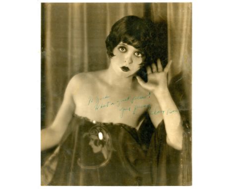 BOW CLARA: (1905-1965) American actress. Vintage signed and inscribed 10 x 12 photograph of The It Girl in an appealing half-