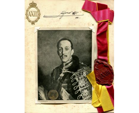 ALFONSO XIII: (1886-1941) King of Spain 1886-1931. An unusual signed presentation montage, the 4to card bearing a good red wa