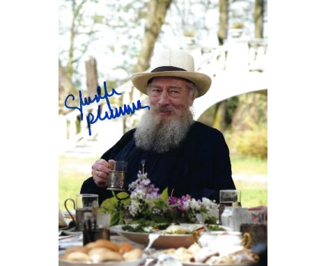 PLUMMER CHRISTOPHER: (1929-2021) Canadian actor, Academy Award winner. Signed colour 8 x 10 photograph of Plummer seated outd