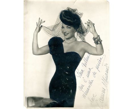 MIRANDA CARMEN: (1909-1955) Portuguese-born Brazilian singer, dancer and actress. Vintage signed and inscribed 11 x 14 photog