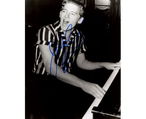 LEWIS JERRY LEE: (1935-2022) American rock 'n' roll singer. Signed 8 x 10 photograph of the youthful Lewis seated in a three-
