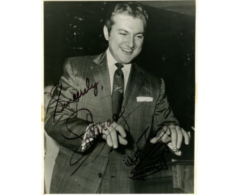 LIBERACE: (1919-1987) American pianist, singer &amp; actor. Vintage signed 8 x 10 photograph of the entertainer standing in a