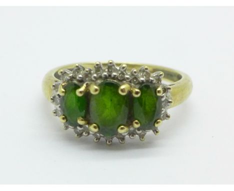 A 9ct gold diamond and green stone ring, 1.9g, J/K 