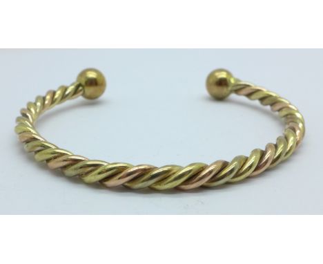 A 9ct gold rope torc bangle, 28.4g 