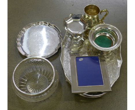 A collection of silver plated items including a gallery tray, boxed, a plated holder, photograph frame, cut glass bowl, etc. 