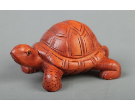 A Japanese carved Netsuke in the form of a tortoise  