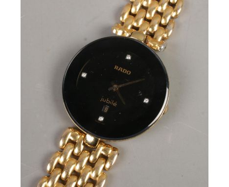 A ladies Rado JubilÃ© wristwatch featuring diamond set dial and yellow metal strap.  One end of strap is missing.