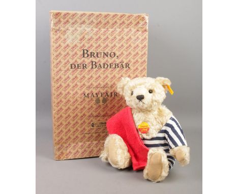 A boxed Steiff bear; Bruno, Der Badebar, the swimming bear. 34cm tall. With growler, tag and button in ear.  Box damaged, rep