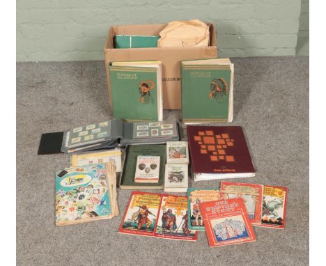 A box of assorted stamps, books and ephemera to include collection of world stamps, first day covers, observers books, People