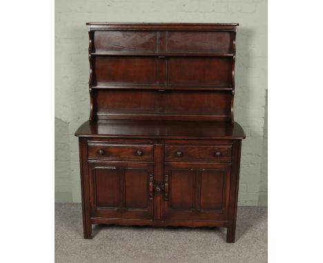 An Ercol dresser with dark stain finish  
