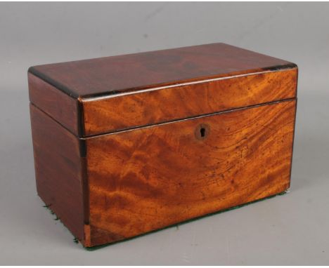 A Regency mahogany tea caddy.  Chip to front left corner.