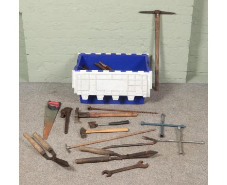 A box of tools. Includes pickaxe, axes, hammers, shears, etc.  