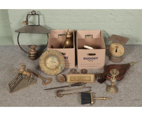Two boxes of mostly brassware. Includes rearing horse figure, large key, hanging oil lamp, erotic plaque, etc.  