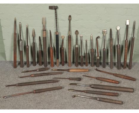 A quantity of large wood turning lathe tools.  