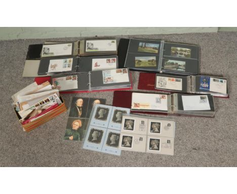 A box of assorted world stamps, first day covers and postcards to include Irish, British and Indian examples.  