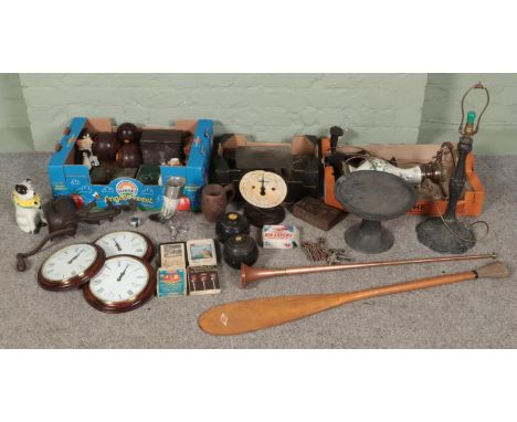 Three boxes of miscellaneous. Includes lawn bowls, ornate metal table lamp, wooden stand, mincers, wall clock, metal mounted 