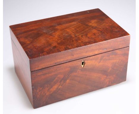 A MID 19TH CENTURY FLAME MAHOGANY TEA CADDY A MID 19TH CENTURY FLAME MAHOGANY TEA CADDY, rectangular, the hinged cover openin