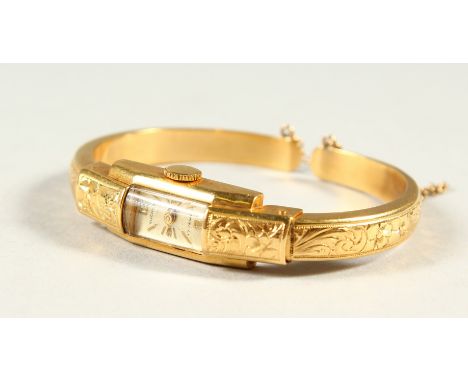 A LADIES' 18K GOLD BOUCHERON BANGLE WATCH.
