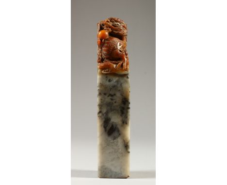 A CHINESE TALL CARVED SOAPSTONE SEAL. 20cms high.