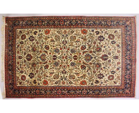 A GOOD PERSIAN "TREE OF LIFE" CARPET, cream ground with trees, flowers , animals and birds within a blue ground border. 304cm