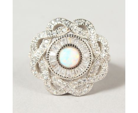 A SILVER AND GILSON OPAL CIRCULAR DRESS RING.