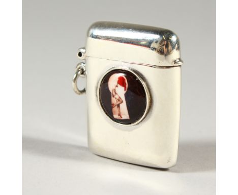 A SMALL SILVER VESTA CASE, with later enamel decoration. 4cms high.