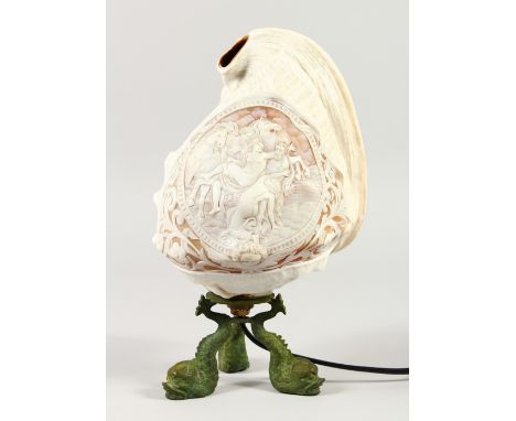 A SUPERB QUALITY CAMEO SHELL LAMP carved with a classical scene, nudes, men and horses, supported on three gilt metal dolphin